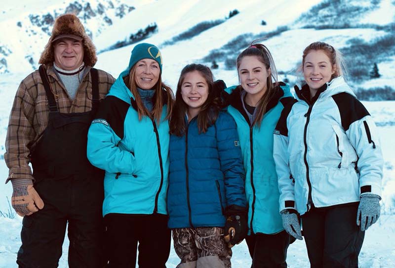 Dr. Oakley Oakley with his husband, Shane and daughters.