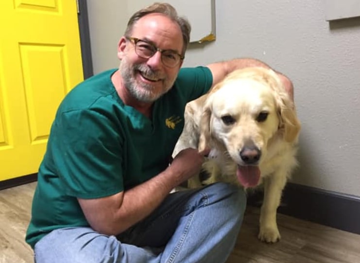 Image of Dr. Jeff Baier with Cooper the therapy dog