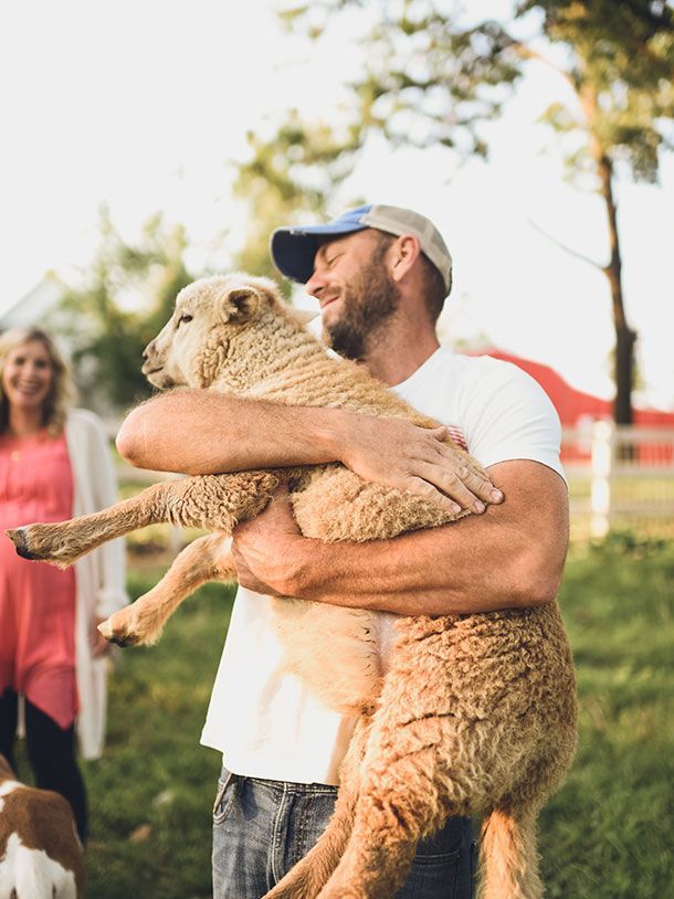 Fixer to Fabulous Dave Marrs holding his farm lamb